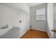 Functional laundry room with utility sink, wire shelving, and natural light at 5312 Tormeal Trce, Suwanee, GA 30024