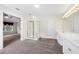 Bright main bathroom boasts double sink vanity, and walk-in shower with glass door at 5312 Tormeal Trce, Suwanee, GA 30024