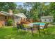 Lush backyard featuring a refreshing in-ground pool and comfortable seating for outdoor gatherings at 5401 Rosser Rd, Tucker, GA 30087