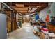 Unfinished basement with exposed ceiling and concrete floor, showing the utility area with storage possibilities at 5401 Rosser Rd, Tucker, GA 30087