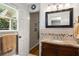 Bathroom with granite countertop vanity, and a view to the outdoors at 5401 Rosser Rd, Tucker, GA 30087