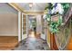 Inviting foyer features decorative French doors, warm slate floors, and a charming floral wreath on the front door at 5401 Rosser Rd, Tucker, GA 30087