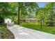 Beautiful ranch-style home with a long driveway, mature trees, and green lawn at 5401 Rosser Rd, Tucker, GA 30087
