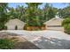 Spacious multi-car garage with a long driveway, offering plenty of parking and storage space at 5401 Rosser Rd, Tucker, GA 30087