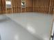 Spacious garage with a newly-sealed light gray floor and framed walls, ready for any hobby at 5401 Rosser Rd, Tucker, GA 30087