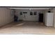 Garage with a tile floor and convenient features like a refrigerator and a utility sink at 5401 Rosser Rd, Tucker, GA 30087