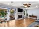 Bright living room with hardwood floors and access to a screened porch and the swimming pool at 5401 Rosser Rd, Tucker, GA 30087