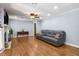 Spacious living room boasts hardwood floors, a cozy fireplace, and ample natural light at 5401 Rosser Rd, Tucker, GA 30087