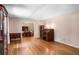 Hardwood living room offers great natural light and views of the dining room at 5401 Rosser Rd, Tucker, GA 30087