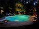 Backyard pool with a diving board and outdoor seating; perfect for summer fun and relaxation at 5401 Rosser Rd, Tucker, GA 30087