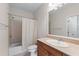 Bathroom featuring a vanity with sink, a tub with shower, and tile accents at 611 Parkside Village Nw Way, Marietta, GA 30060