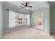 Bright bedroom with large windows and access to an outdoor deck with double glass doors at 611 Parkside Village Nw Way, Marietta, GA 30060
