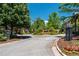 Picturesque street view showcasing lush landscaping and elegant homes within a gated community at 611 Parkside Village Nw Way, Marietta, GA 30060