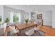 Bright dining room with wood table, white chairs, and large windows with natural light at 611 Parkside Village Nw Way, Marietta, GA 30060