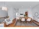 Bright dining room with wood table, white chairs, and access to other rooms at 611 Parkside Village Nw Way, Marietta, GA 30060