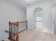 Upstairs hallway featuring an archway and carpet at 611 Parkside Village Nw Way, Marietta, GA 30060