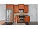 Kitchen with stainless steel appliances, wood cabinets, granite countertops and tile backsplash at 611 Parkside Village Nw Way, Marietta, GA 30060
