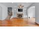 Spacious living room featuring hardwood floors, fireplace, and built-in shelving at 611 Parkside Village Nw Way, Marietta, GA 30060