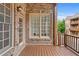 Patio with brick wall, wood railings, and view of townhome exterior at 611 Parkside Village Nw Way, Marietta, GA 30060