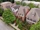 Charming homes nestled among lush trees, each with unique architectural details and well-kept lawns at 1220 State Nw St, Atlanta, GA 30318