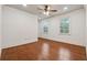 Spacious bedroom featuring hardwood floors, neutral walls and natural light from two windows at 1220 State Nw St, Atlanta, GA 30318