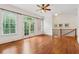 Bedroom features hardwood floors, fan, many windows and a balcony access at 1220 State Nw St, Atlanta, GA 30318