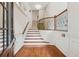 Bright foyer with hardwood floors, staircase and wrought iron bannister at 1220 State Nw St, Atlanta, GA 30318