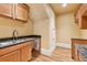 Stylish kitchen with a stainless steel sink, black granite countertops, and wooden cabinets at 1220 State Nw St, Atlanta, GA 30318
