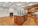 Spacious kitchen featuring stainless steel appliances, wooden cabinets, an island, and hardwood floors at 1220 State Nw St, Atlanta, GA 30318