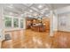 Open kitchen and living area with hardwood floors, large island and stainless appliances at 1220 State Nw St, Atlanta, GA 30318