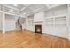 Inviting living area with a fireplace, built-in shelves and hardwood floors at 1220 State Nw St, Atlanta, GA 30318