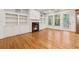 Open living area with fireplace, hardwood floors and built-in bookshelves at 1220 State Nw St, Atlanta, GA 30318