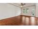 Bright main bedroom features a ceiling fan, and access to a private balcony with natural light at 1220 State Nw St, Atlanta, GA 30318