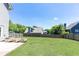 A large backyard with a well-manicured lawn and tall wooden fences at 2167 Tilson Rd, Decatur, GA 30032