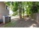 Private backyard with a storage shed and trees, offering a serene outdoor space at 2167 Tilson Rd, Decatur, GA 30032
