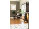 Bright breakfast nook area with decorative table, chairs, and an antique cabinet at 2167 Tilson Rd, Decatur, GA 30032
