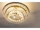 Elegant chandelier featuring crystals and decorative metalwork at 2167 Tilson Rd, Decatur, GA 30032