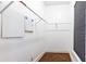 Empty walk-in closet featuring minimalist shelving and storage solutions at 2167 Tilson Rd, Decatur, GA 30032