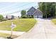 Inviting home with a long driveway and curb appeal, set on a well-manicured lawn at 2167 Tilson Rd, Decatur, GA 30032