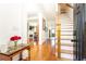 Bright foyer featuring hardwood floors, stairway and open access to the home's living spaces at 2167 Tilson Rd, Decatur, GA 30032