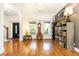 Bright, open foyer with hardwood floors, elegant columns, and stylish furnishings at 2167 Tilson Rd, Decatur, GA 30032