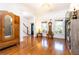 Spacious foyer featuring hardwood floors, high ceilings, and an antique armoire at 2167 Tilson Rd, Decatur, GA 30032