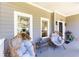 Inviting front porch with cozy seating, plants, and charming curb appeal at 2167 Tilson Rd, Decatur, GA 30032