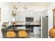Updated kitchen with white cabinets, stainless appliances, and modern fixtures at 2167 Tilson Rd, Decatur, GA 30032