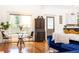 Sun-filled living room with stylish seating, hardwood floors, and vintage furniture at 2167 Tilson Rd, Decatur, GA 30032