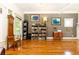 Elegant living room with hardwood floors, built-in shelving, and natural light at 2167 Tilson Rd, Decatur, GA 30032