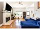 Comfortable living room featuring a fireplace, hardwood floors, and lots of natural light at 2167 Tilson Rd, Decatur, GA 30032