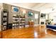 Spacious living room with a fireplace, built-in shelving, and hardwood floors at 2167 Tilson Rd, Decatur, GA 30032