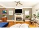 Comfortable living room showcasing a fireplace with TV, and stylish furnishings at 2167 Tilson Rd, Decatur, GA 30032