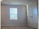Bright bedroom with window and closet, showcasing a clean and inviting space at 246 Crabapple Rd, Mcdonough, GA 30253